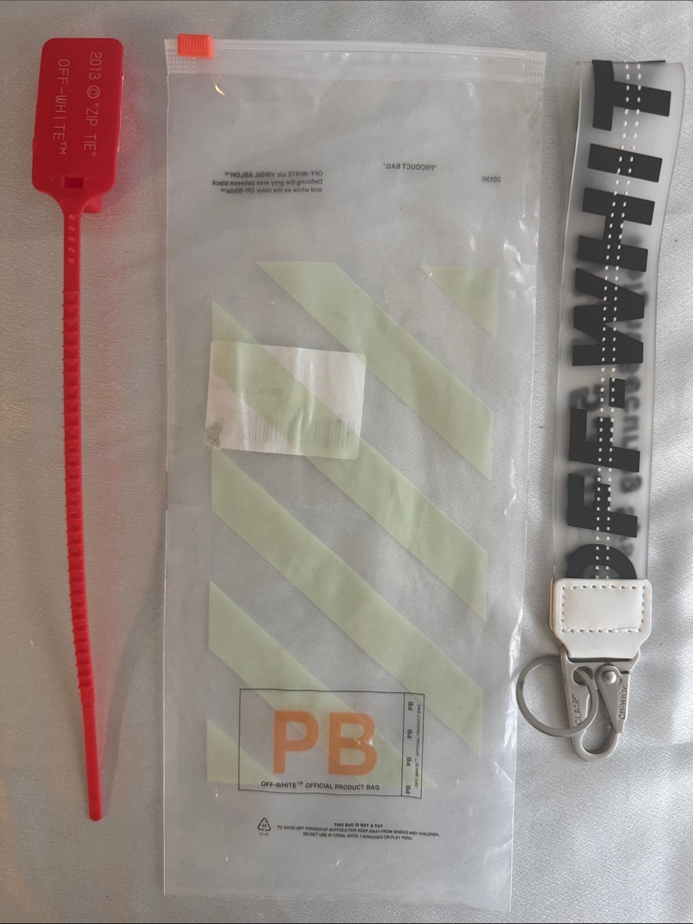 New! Off-White White Nylon Key Strap with Black Diagonal Text and Red Zip Tie